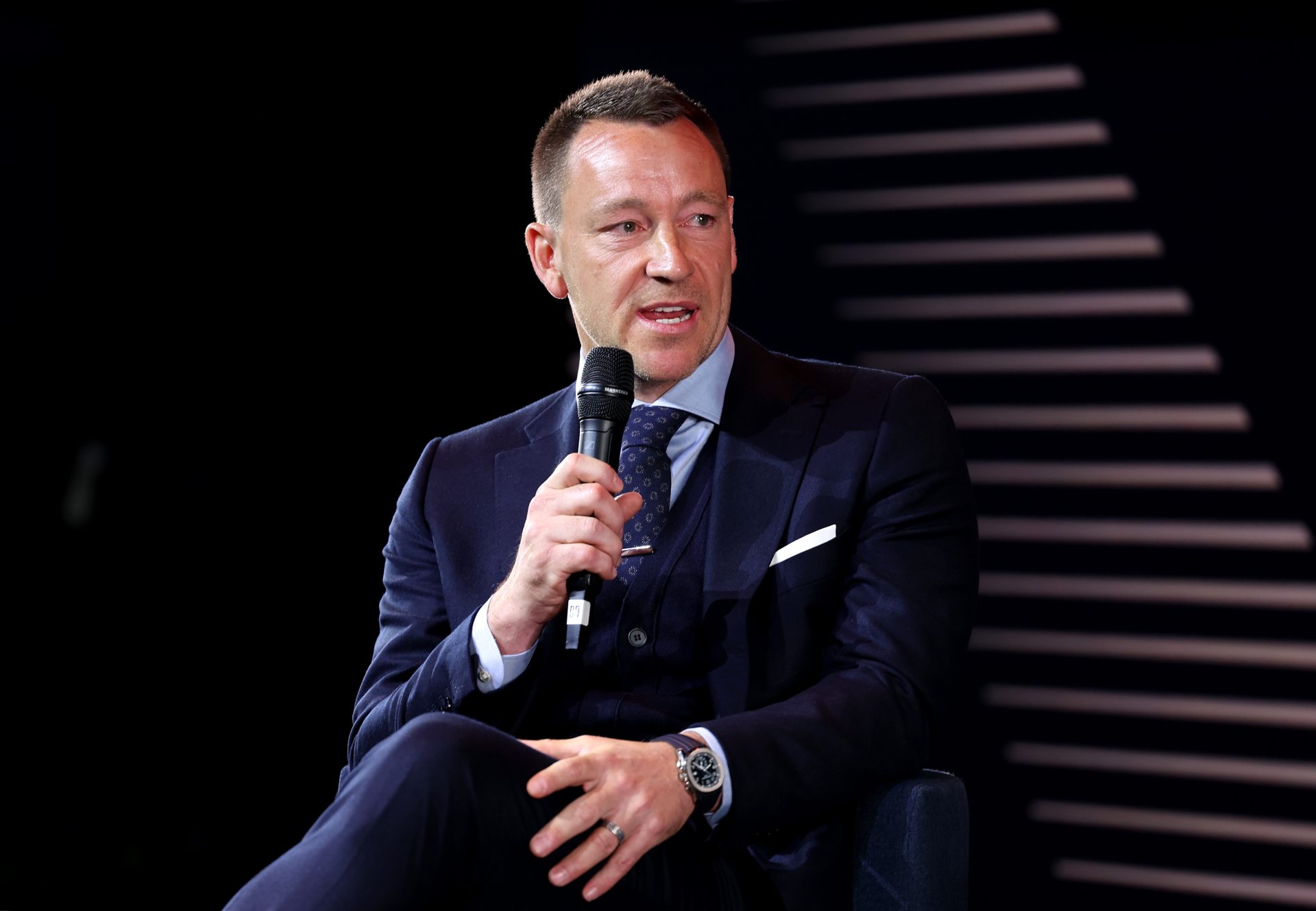 John Terry speaks at a forum.