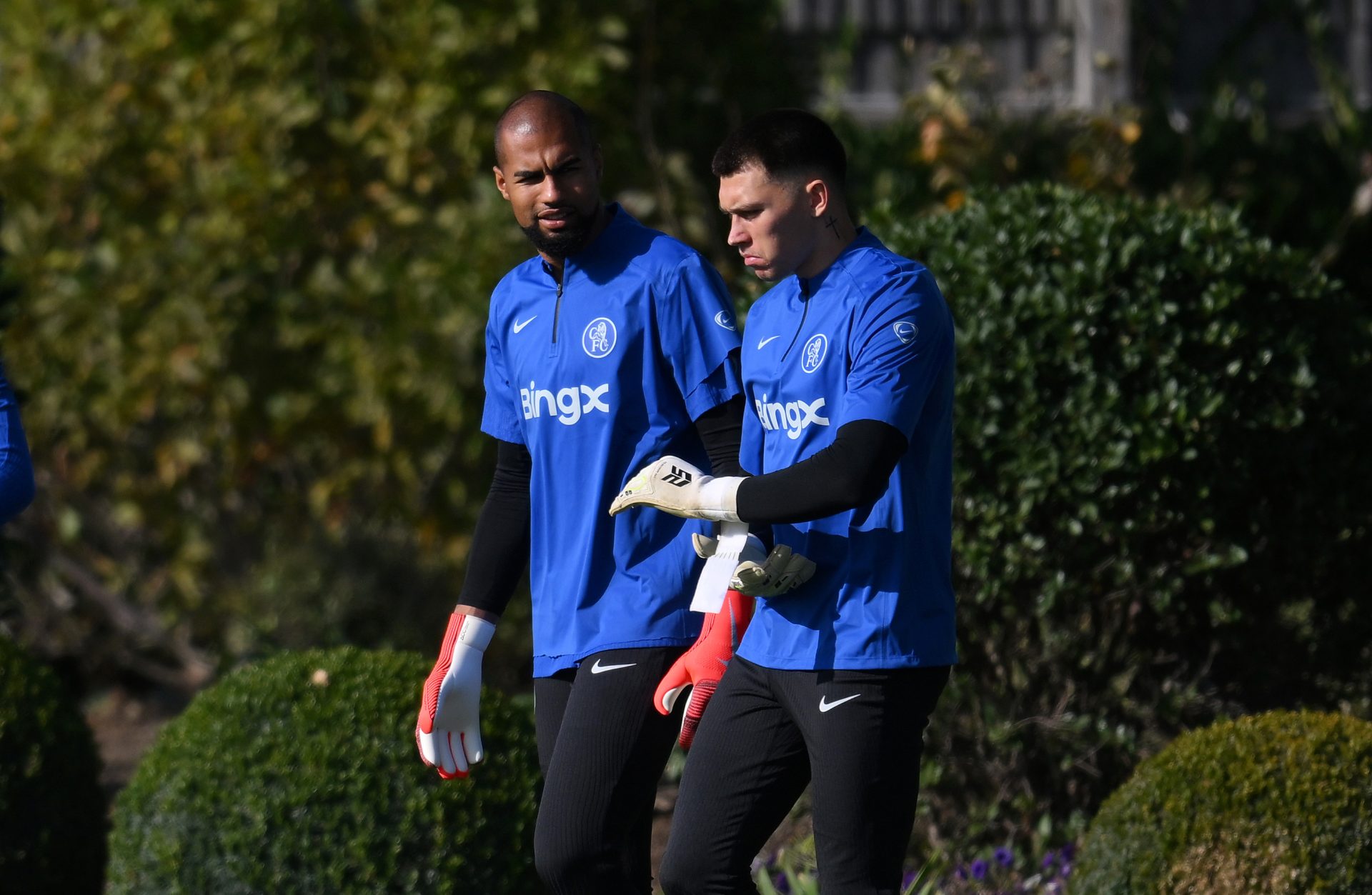 Robert Sanchez and Gabriel Slonina of Chelsea walk out during a Chelsea Training Session