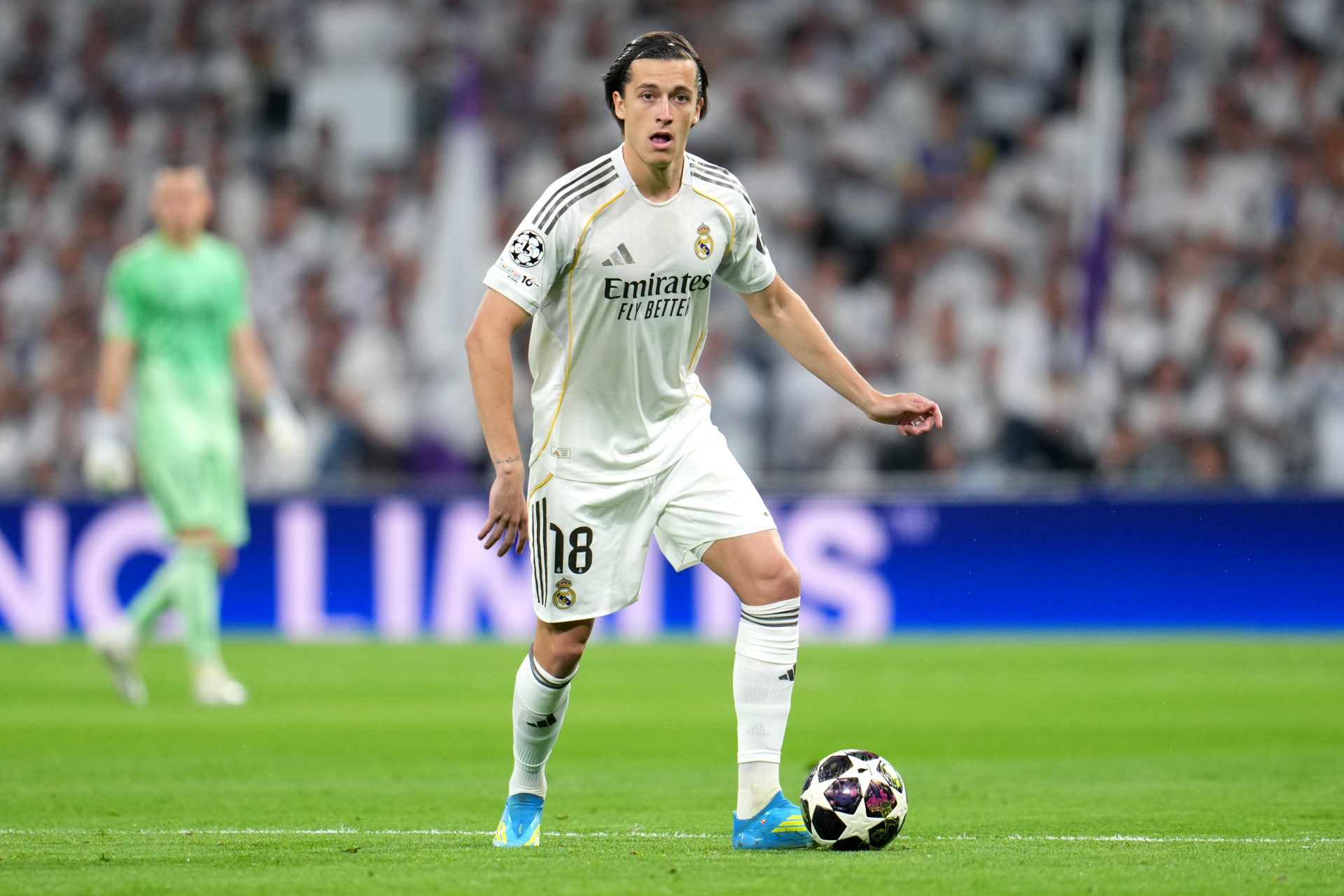 Alvaro Carreras of Real Madrid runs with the ball during the UEFA Champions League