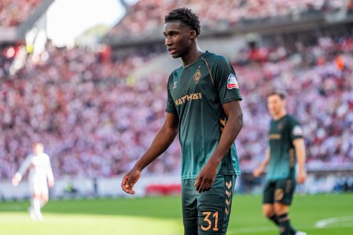 Karim Coulibaly shepherds the ball.