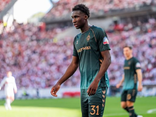Karim Coulibaly shepherds the ball.