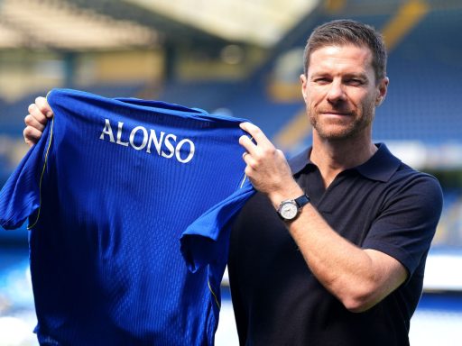 New Chelsea manager Xabi Alonso at Stamford Bridge holding Chelsea shirt