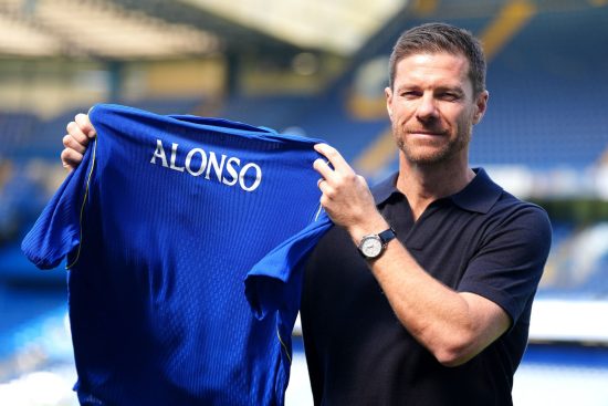 New Chelsea manager Xabi Alonso at Stamford Bridge holding Chelsea shirt