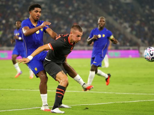 Francesco Camarda of AC Milan controls the ball against Wesley Fofana