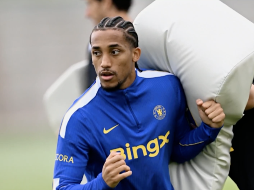 Joao Pedro prepares with a rugby tackle bag