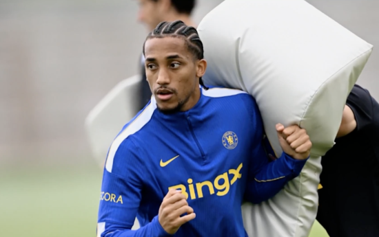 Joao Pedro prepares with a rugby tackle bag
