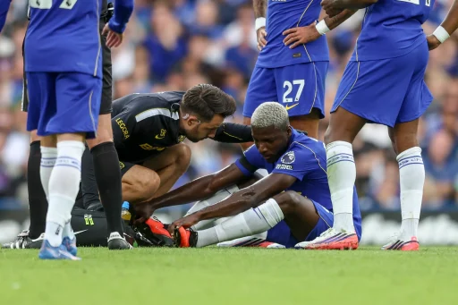 Moisés Caicedo of Chelsea goes down injured