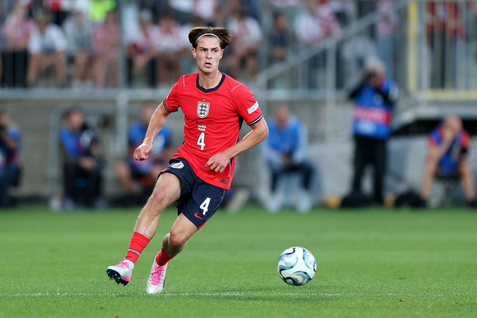 Alex Scott of England passes the ball