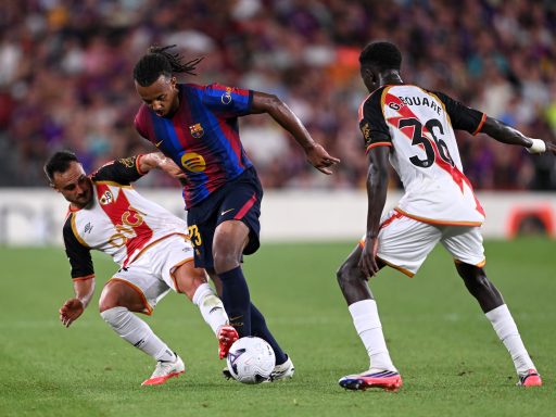 Jules Kounde of Barcelona is challenged by Alvaro Garcia of Rayo Vallecano